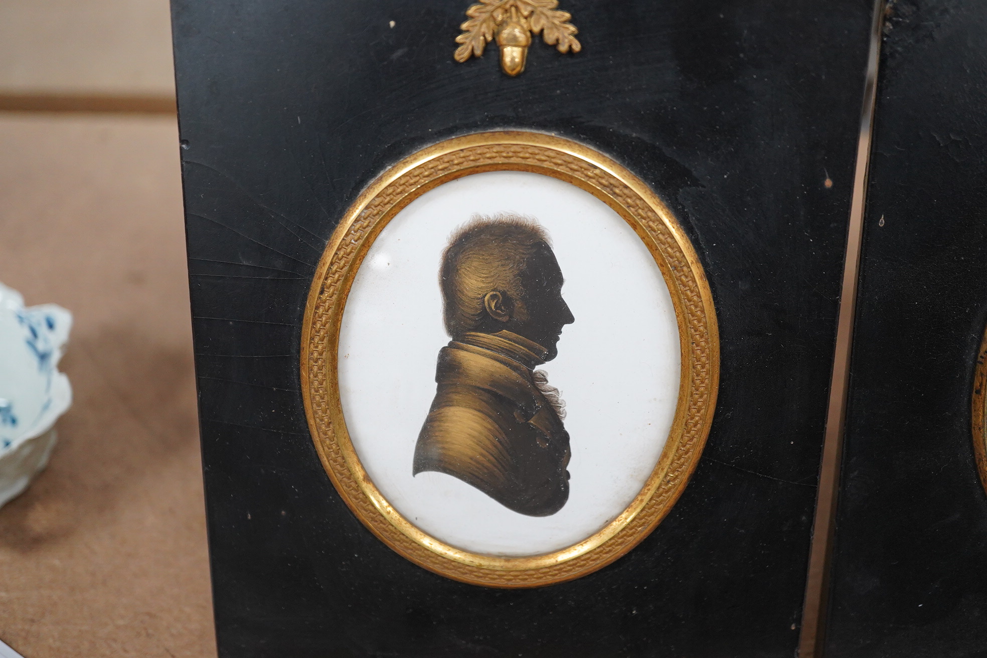 Miers & Field, two bronzed painted plaster silhouettes of gentlemen, framed. Condition - good